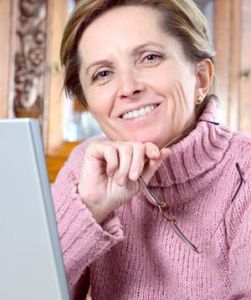Smiling woman holding glasses